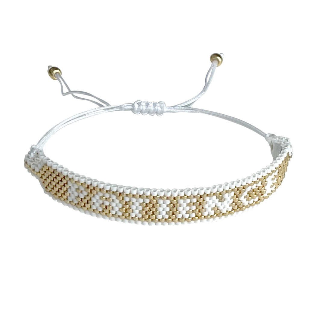 Patience Gold and White beaded adjustable bracelet.