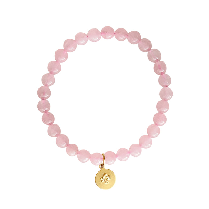 Rose Quartz stone stretch bracelet with gold disc stamped with cross.