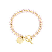 Load image into Gallery viewer, Vine gold-plated bracelet with pink enamel, toggle, and disc charm with cross
