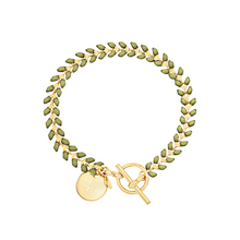 Load image into Gallery viewer, Vine gold-plated bracelet with olive green enamel, toggle, and disc charm with cross
