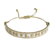 Load image into Gallery viewer, Gentleness Gold and White beaded adjustable bracelet.
