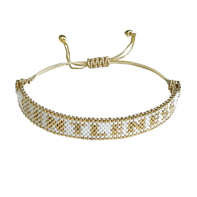 Gentleness Gold and White beaded adjustable bracelet.