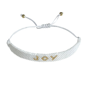 Joy Gold and White beaded adjustable bracelet.