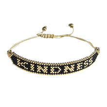 Load image into Gallery viewer, Kindness Gold and Black beaded adjustable bracelet.
