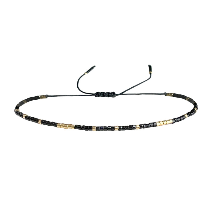 Gold and black beaded adjustable bracelet perfect for layering.