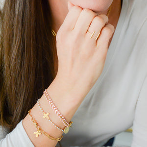 gold, cross bracelet with white enamel bead chain