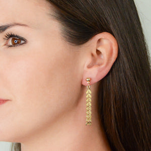 14k gold-plated ball stud earrings with vine and leaf chain looped to earring back