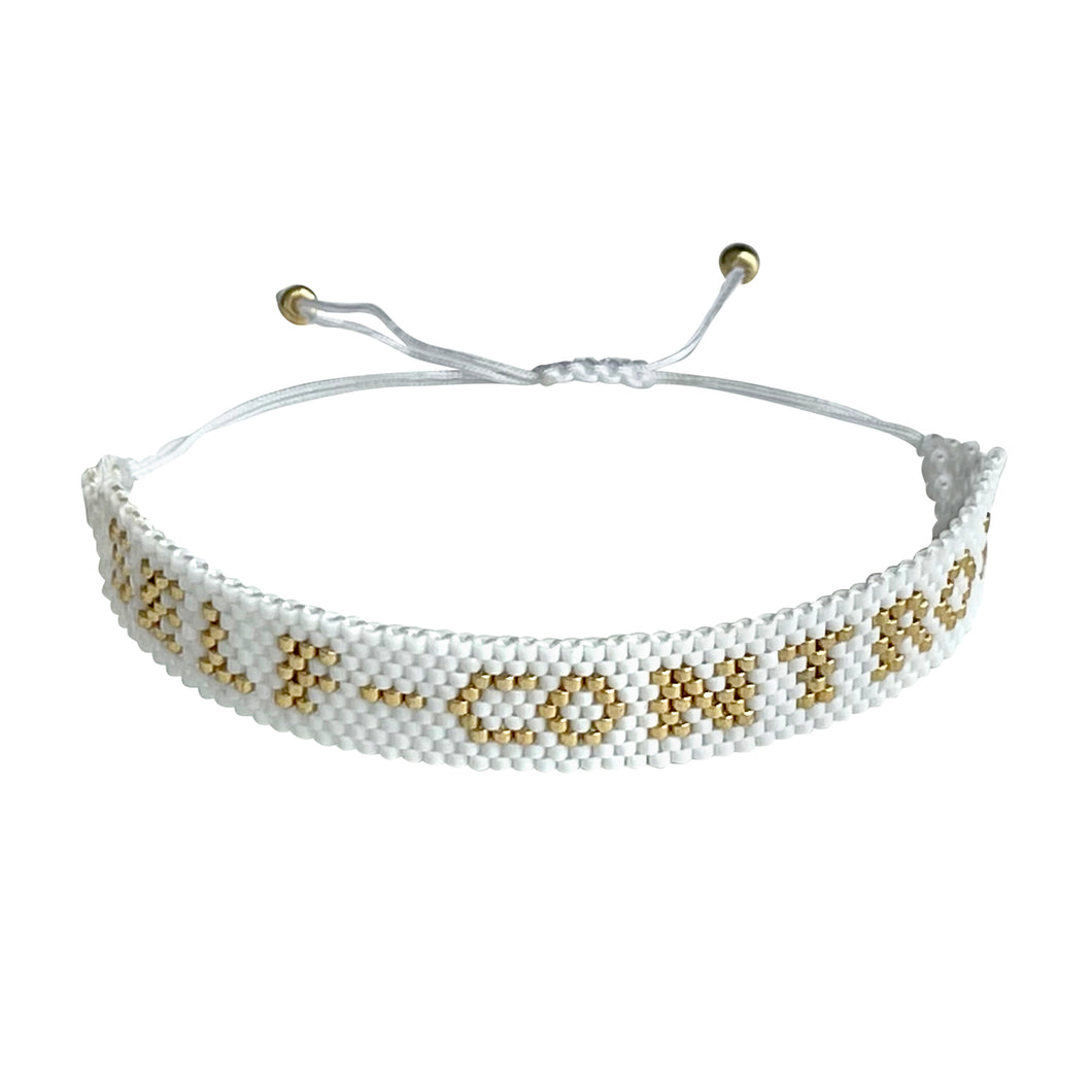 Self-Control Gold and White beaded adjustable bracelet.