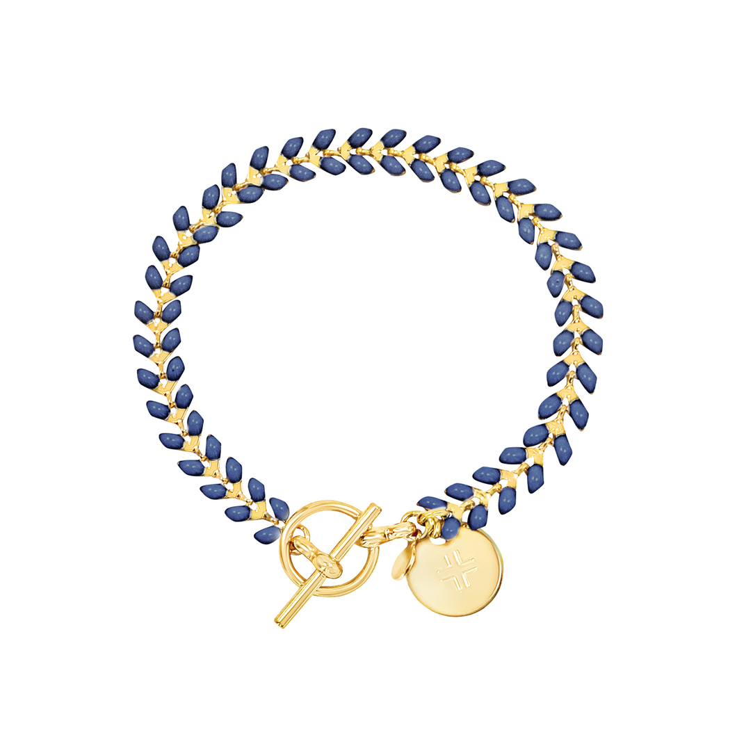 Vine gold-plated bracelet with navy enamel, toggle, and disc charm with cross