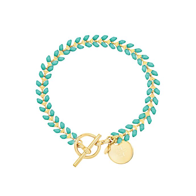 Vine gold-plated bracelet with turquoise enamel, toggle, and disc charm with cross