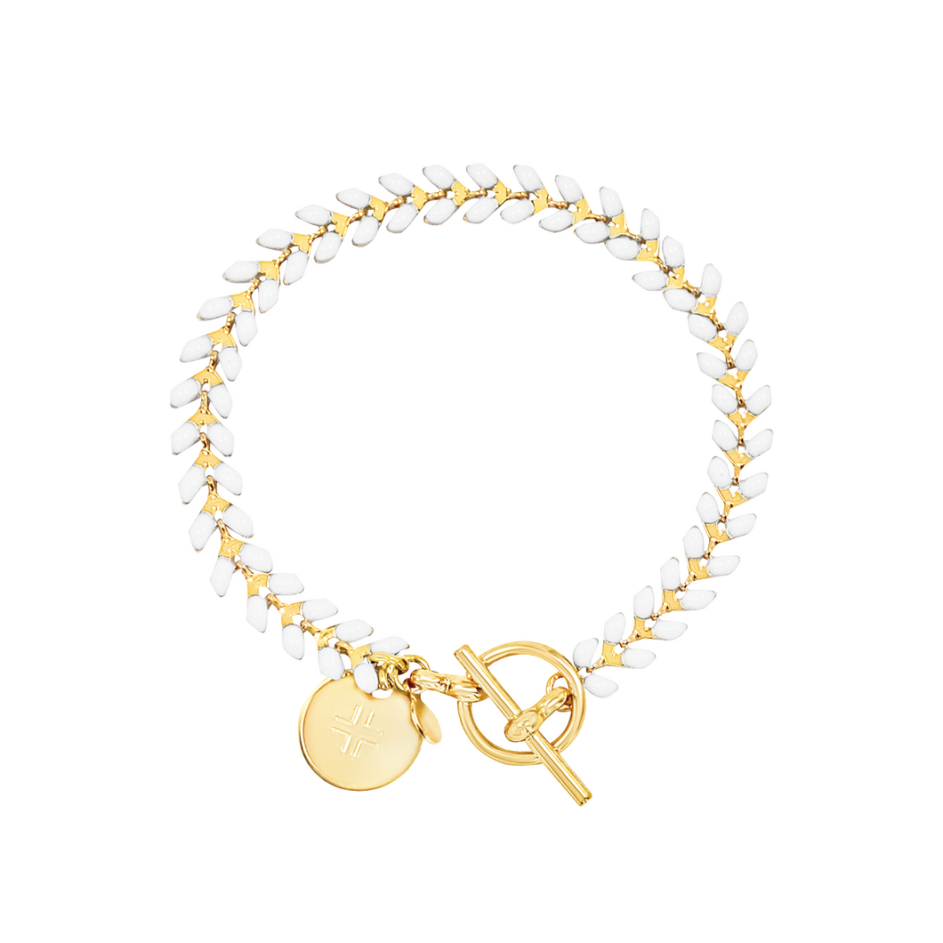 Vine gold-plated bracelet with white enamel, toggle, and disc charm with cross